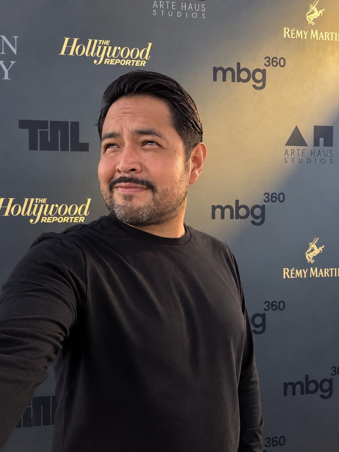 Eduardo Ramos at a premium event step-and-repeat backdrop